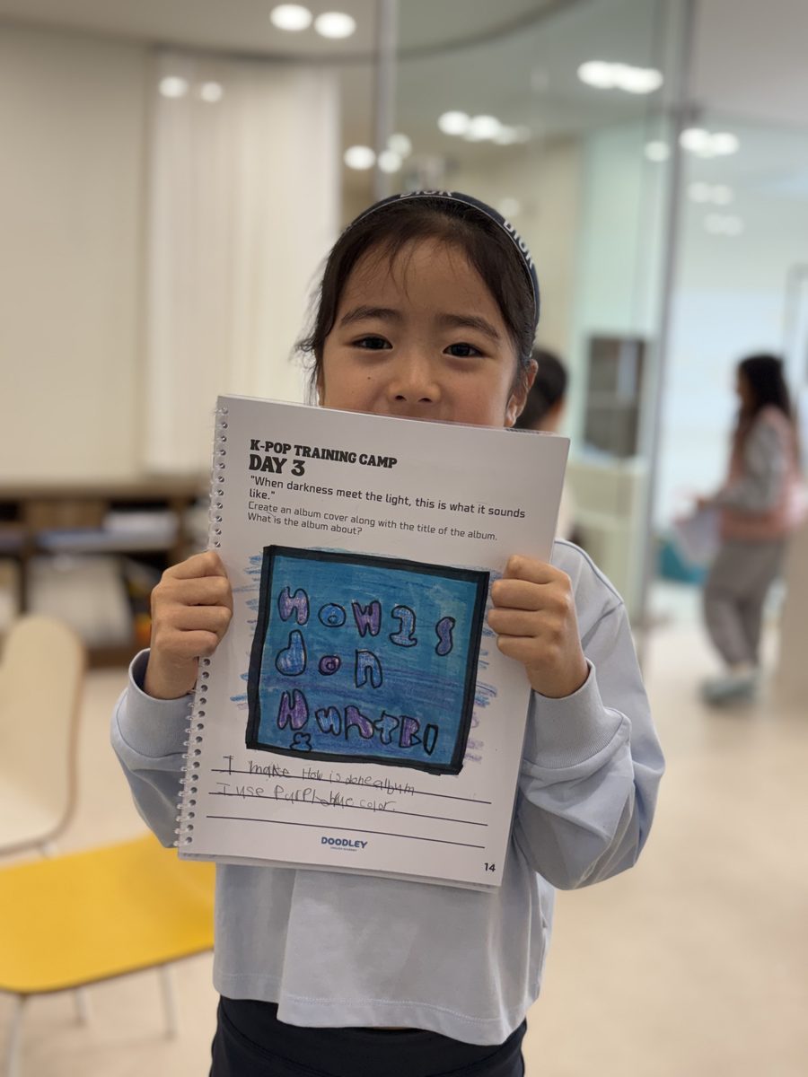 Child showing their workbook