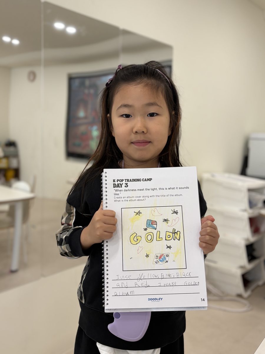 Child showing their project